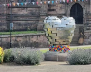 Heart-shaped Metal Statue Outside Rotherham Town Centre Church. Collaboration and Support Among Rotherham Businesses