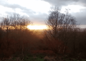 A photo of Boston Castle at sunset, with the stunning countryside in the background