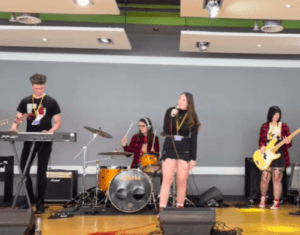 Rotherham College Performing Arts students singing and playing instruments