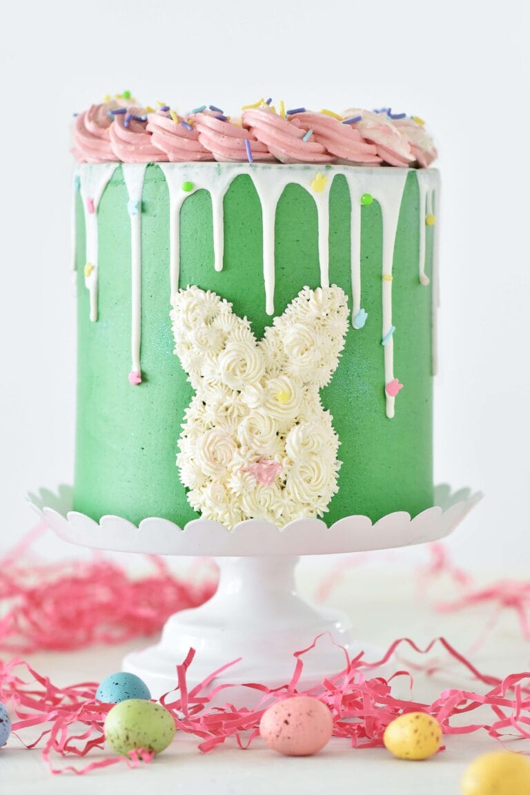 Rotherham Happy Easter. Delicious Easter cake decorated with pastel-colored frosting and candy eggs on top.